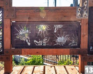 A Corten steel panel laser cut with a design for the Three Creeks Confluence Park