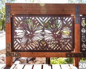 A Corten steel panel laser cut with a design for the Three Creeks Confluence Park