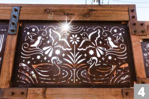 A Corten steel panel laser cut with a design for the Three Creeks Confluence Park